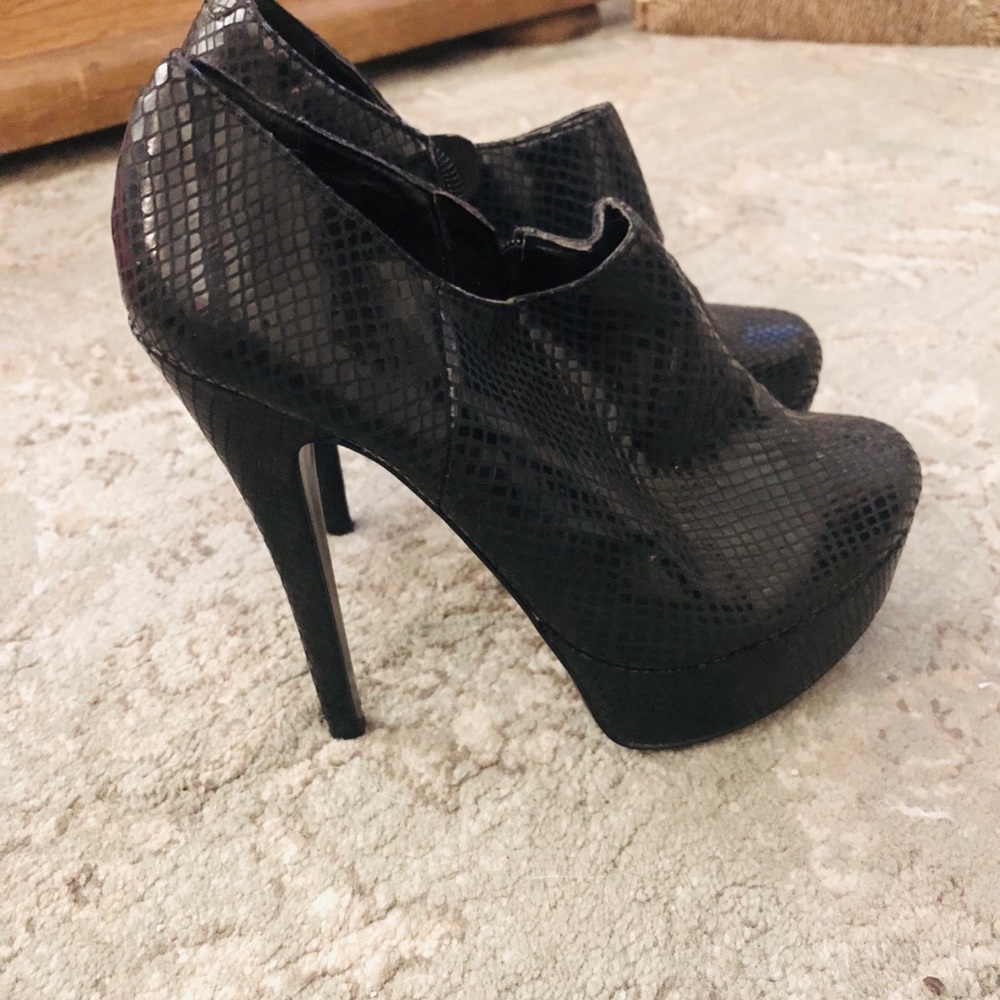 High heeled black booties